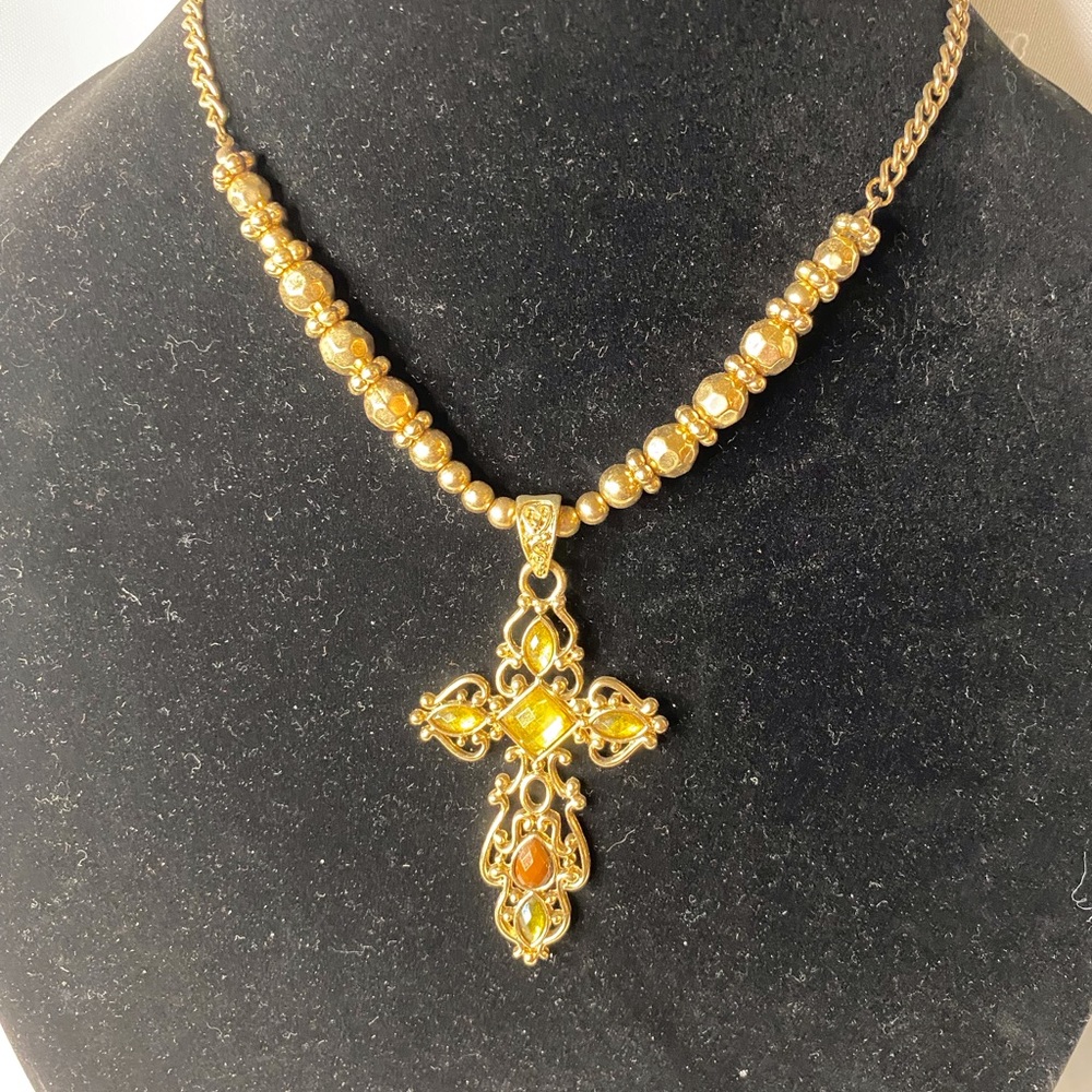 Pretty gold cross neckless with gold and Burgundy stones $20
